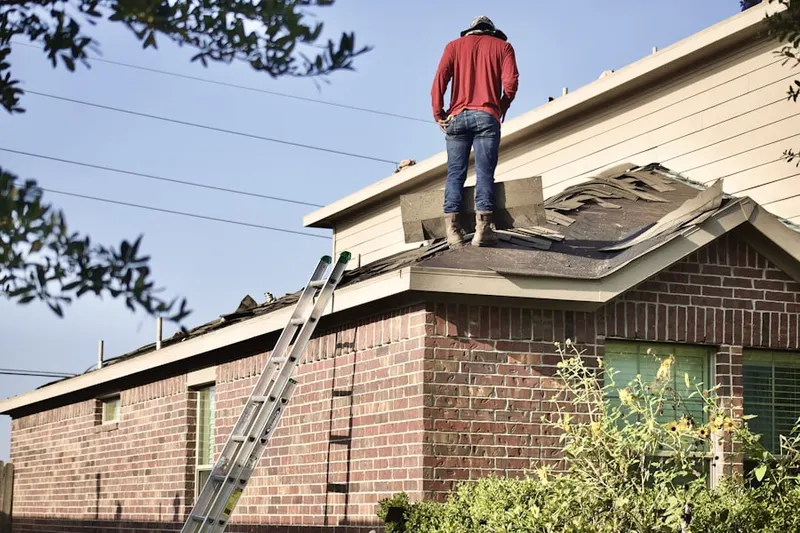 Professional roofer working on a residential roof in Prairie du Chien